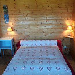 Lit ambiance chalet dans le séjour - Location de vacances - Métabief