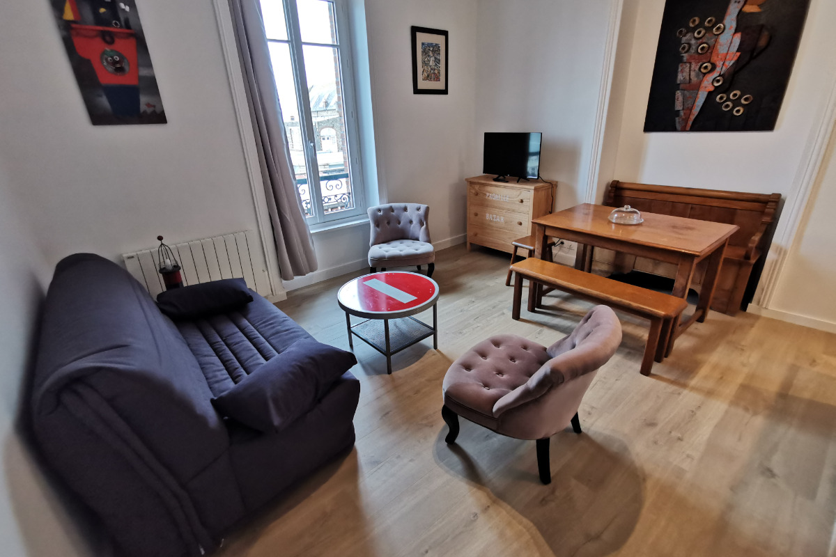 Salon avec canapé lit et espace repas - Location de vacances - Dinard